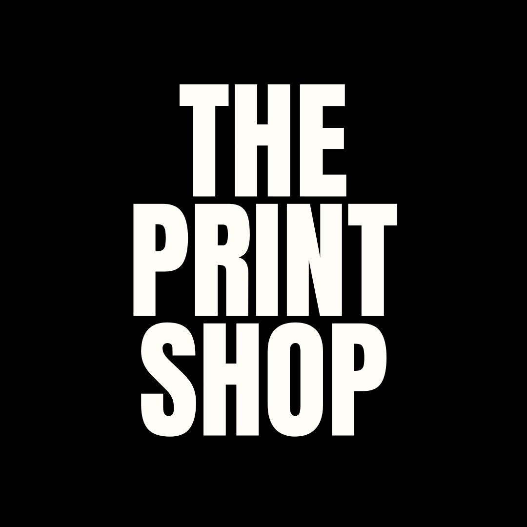 White, bold, all-caps text reading THE PRINT SHOP centered on a solid black background.